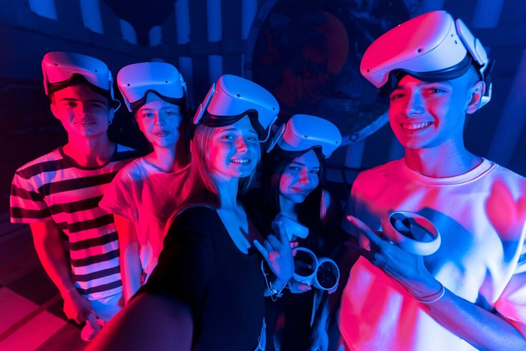 A team of young friends taking selfie while using virtual reality VR equipment on a arena